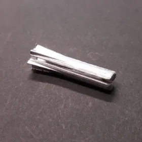 Fixing for bus-bar conductors to fl at surface.