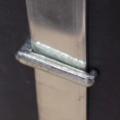 Fixing for bus-bar conductors to flat surface.