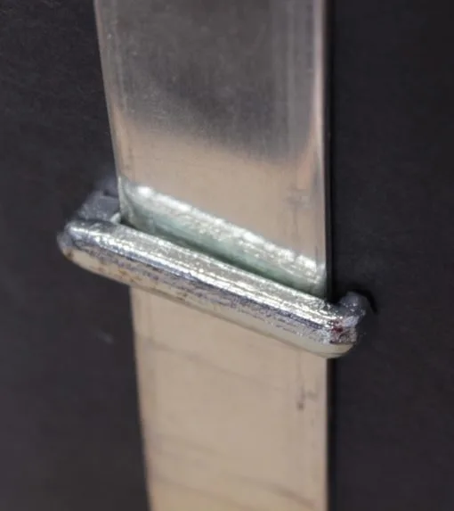 Fixing for bus-bar conductors to flat surface.