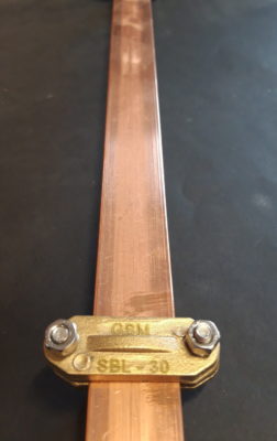 Brass supports for copper busbars