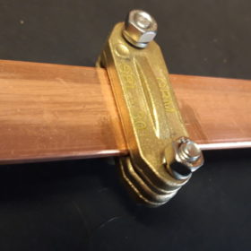 Brass supports for copper busbars